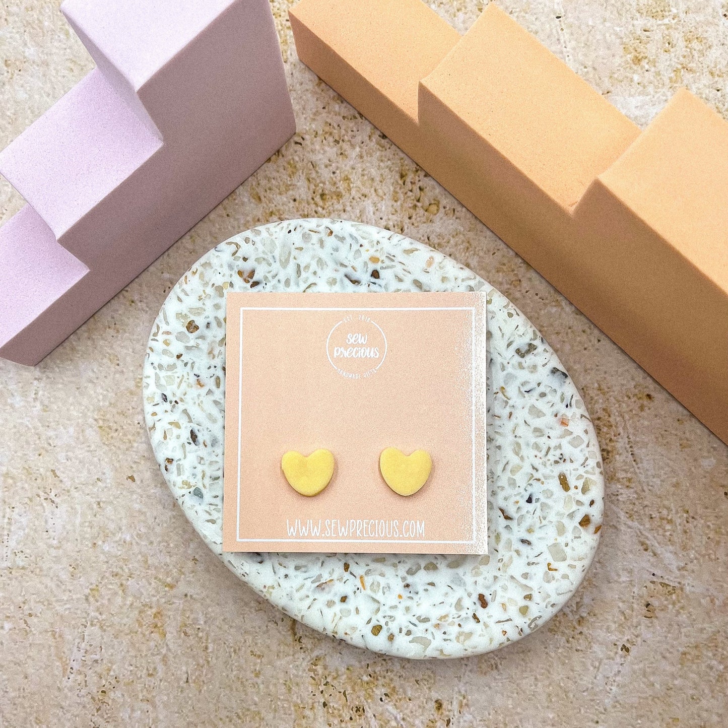 Buttercup heart studs