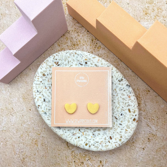 Buttercup heart studs
